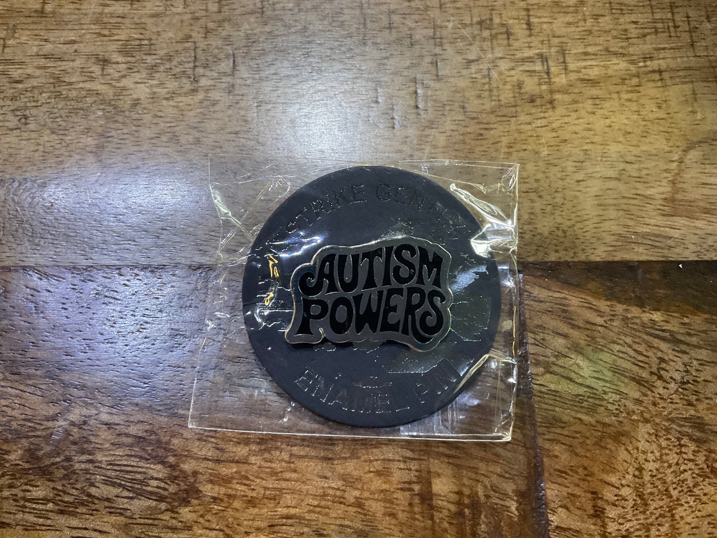 AUTISM POWERS ENAMEL PIN