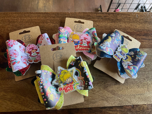 STRAWBERRY/RAINBOW FAUX LEATHER BOW CLIP